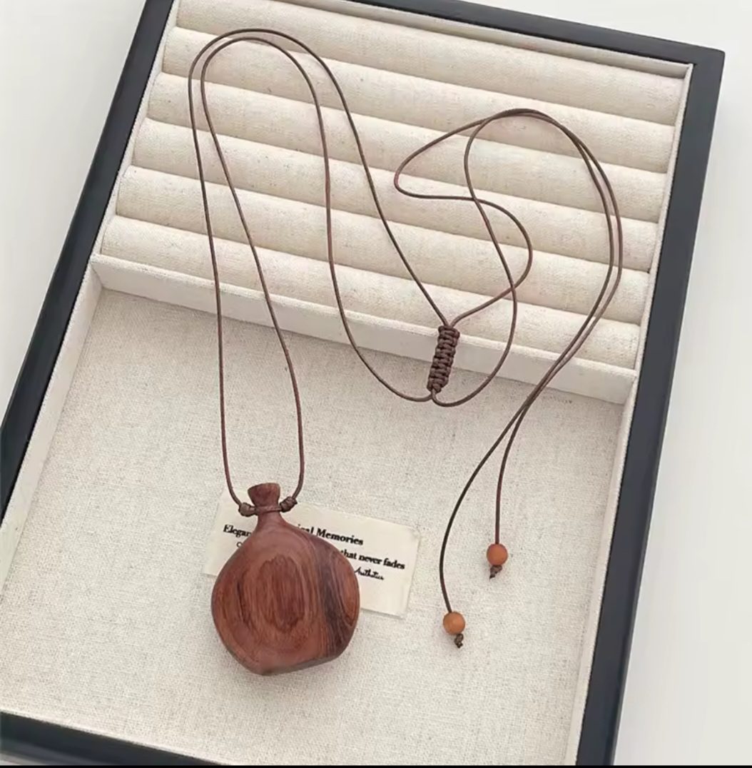 Vintage hals ketting van hout - lange ketting met fles vorm - aparte opvallende ketting